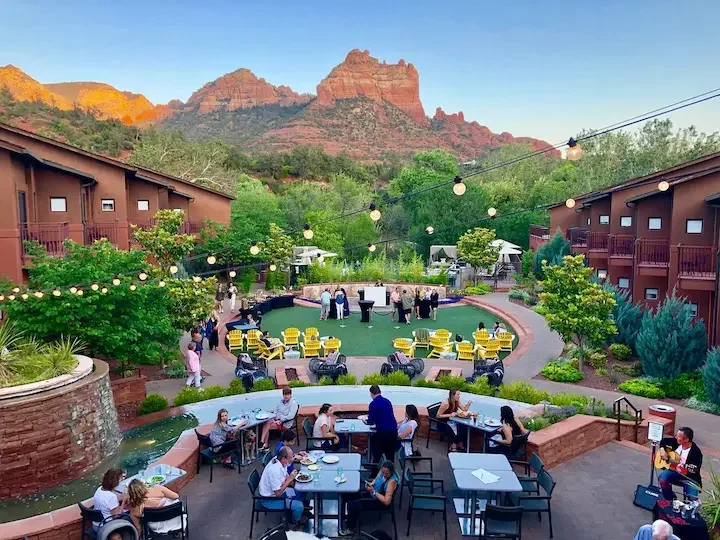 People gathering in a landscaped outdoor courtyard