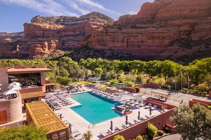 A pool terrace surrounded by red canyon walls