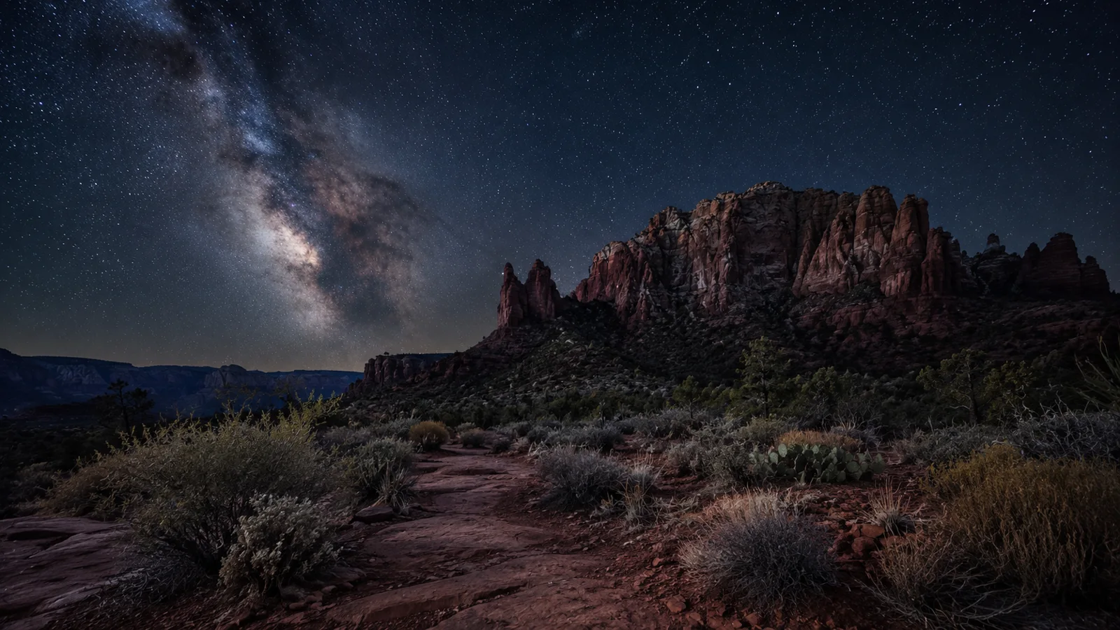 AI-generated illustration: the Milky Way above a dark desert landscape