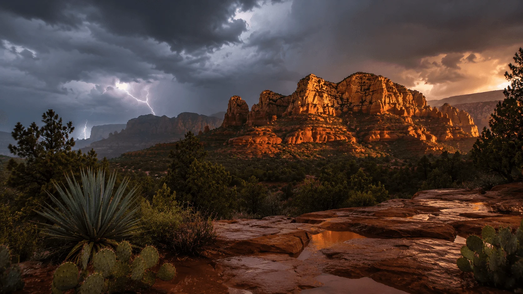 Sunlight breaking through storm clouds over red-rock formations