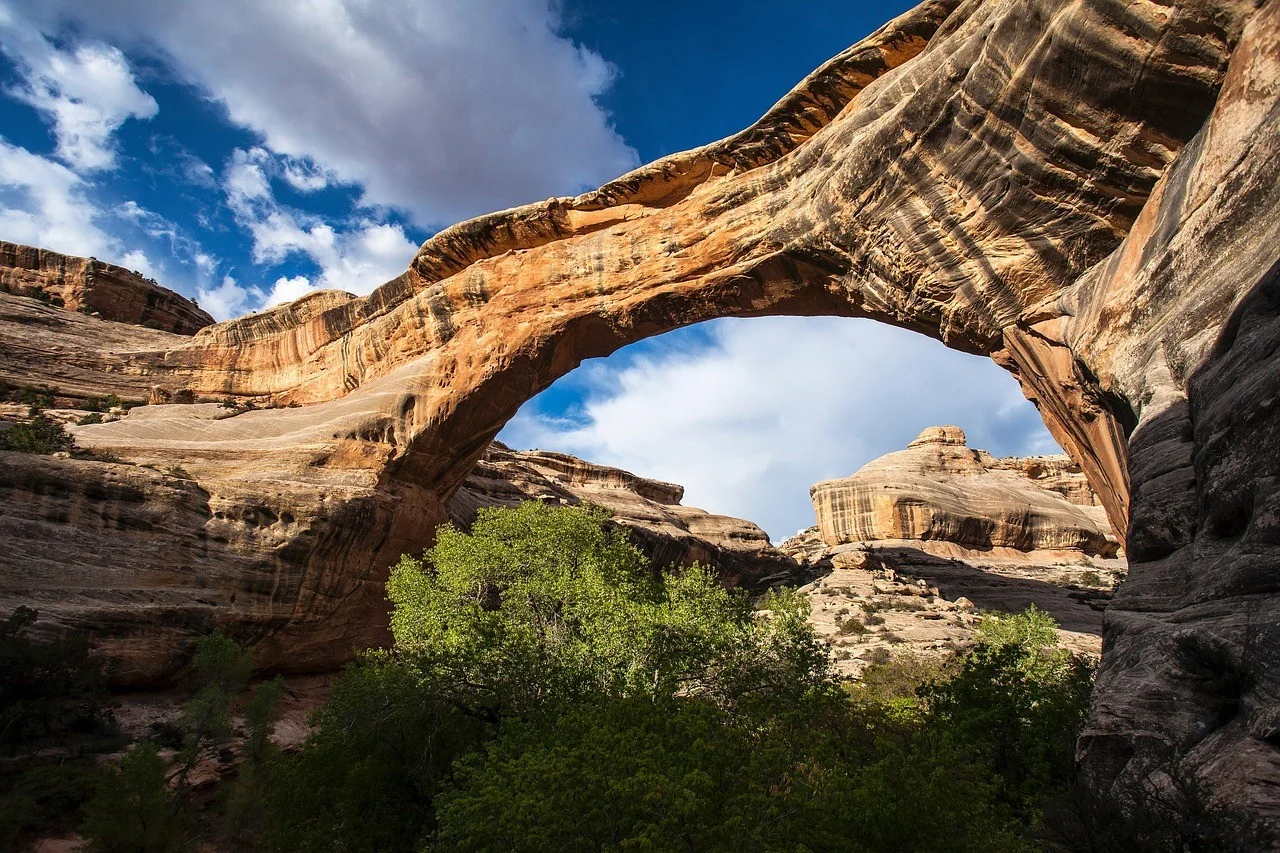 A natural stone bridge spanning a rocky canyon