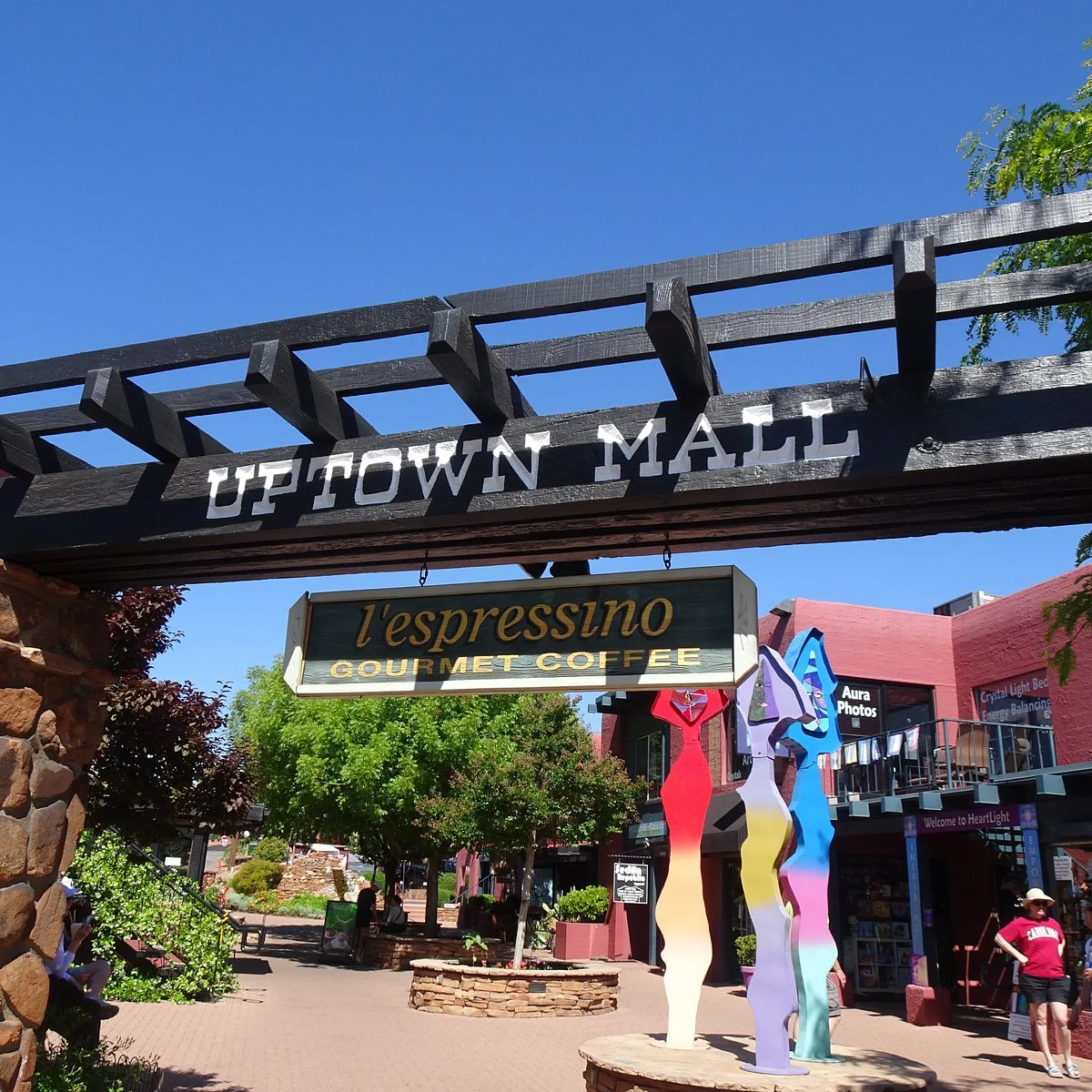 An Uptown Mall entrance with storefronts beyond